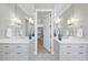 This bathroom features dual sinks and vanities with a walk in closet across the hall at 3410 Bradley Pl, Raleigh, NC 27607