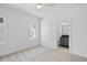Bright bedroom featuring neutral carpeting, modern ceiling fan, and bathroom ensuite at 3410 Bradley Pl, Raleigh, NC 27607