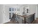 Bright foyer boasts natural light, open staircase with iron railing, and decorative chandelier at 3410 Bradley Pl, Raleigh, NC 27607