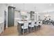 Spacious kitchen with a large island, bar seating, white countertops, and modern appliances at 3410 Bradley Pl, Raleigh, NC 27607