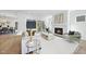 Cozy living room with fireplace, plush seating, hardwood floors, and access to outdoor patio at 3410 Bradley Pl, Raleigh, NC 27607