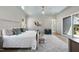 This bedroom features a chevron rug, sitting chair and access to the en suite bathroom at 3410 Bradley Pl, Raleigh, NC 27607