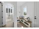Bright mudroom features custom bench seating with storage and designer throw pillows, and hardwood flooring at 3410 Bradley Pl, Raleigh, NC 27607