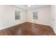 Empty bedroom with two bright windows at 42 Oakwood Dr, Chapel Hill, NC 27517