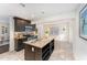 Open-concept kitchen featuring custom cabinets, granite countertops, stainless steel appliances, and a breakfast nook at 42 Oakwood Dr, Chapel Hill, NC 27517