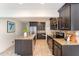 Kitchen showcasing custom cabinets, granite countertops, stainless steel appliances, and tiled backsplash at 42 Oakwood Dr, Chapel Hill, NC 27517
