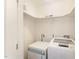 Bright laundry room features washer, dryer, and storage shelves for efficient organization at 42 Oakwood Dr, Chapel Hill, NC 27517