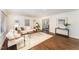 Bright living room featuring hardwood floors, a patterned rug, and stylish contemporary furniture at 42 Oakwood Dr, Chapel Hill, NC 27517