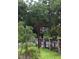 Sign identifies Oakwood Park at entrance with stone columns and iron fencing at 42 Oakwood Dr, Chapel Hill, NC 27517