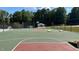 A vibrant outdoor basketball court featuring cornhole boards for recreational activities at 123 Wichita Way, Louisburg, NC 27549