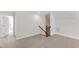 Large bonus room with neutral walls and carpet with access to the staircase and another room at 123 Wichita Way, Louisburg, NC 27549