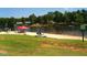 Lake view of a community beach with people enjoying the lake and sunshine at 123 Wichita Way, Louisburg, NC 27549