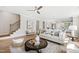 Spacious living room with a staircase, plush seating, and an inviting ambiance at 123 Wichita Way, Louisburg, NC 27549