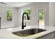 Modern kitchen sink and faucet with white quartz countertops at 137 Buckaroo Dr, Louisburg, NC 27549