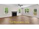 Living room featuring hardwood floors and a fireplace at 137 Buckaroo Dr, Louisburg, NC 27549