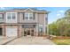 Image of a D.R. Horton townhome exterior with a builder's sign and stone accents at 1823 Hinesley Dr, Durham, NC 27703