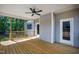 Wooden porch with a fan and sliding glass doors for natural light indoors at 235 Sequoia Dr, Louisburg, NC 27549