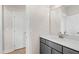 Modern bathroom vanity with a grey cabinet, white countertop, and a mirror at 235 Sequoia Dr, Louisburg, NC 27549