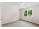Bright bedroom with neutral carpet, a window, and soft natural light at 235 Sequoia Dr, Louisburg, NC 27549