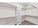 Spacious walk-in closet with built-in shelving and ample storage space at 235 Sequoia Dr, Louisburg, NC 27549
