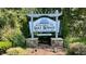 Welcome to Lake Royale sign with manicured landscaping and a stone base at 235 Sequoia Dr, Louisburg, NC 27549