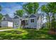 Attractive home showcasing a well-maintained lawn, professional landscaping, and appealing curb appeal at 235 Sequoia Dr, Louisburg, NC 27549