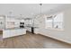 Eat-in kitchen area featuring white cabinets, granite countertops, and stainless appliances at 235 Sequoia Dr, Louisburg, NC 27549