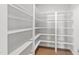 Spacious walk-in pantry with custom shelving, offering ample storage for kitchen essentials at 235 Sequoia Dr, Louisburg, NC 27549