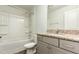 Bathroom featuring tub/shower combo, granite countertops, and gray vanity at 7533 Poplar Meadow Ln, Raleigh, NC 27616