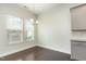 Bright dining area with hardwood floors next to large windows for lots of natural light at 7533 Poplar Meadow Ln, Raleigh, NC 27616