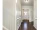 Elegant entryway with dark wood flooring and wainscoting detail at 7533 Poplar Meadow Ln, Raleigh, NC 27616