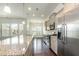 Kitchen featuring stainless steel appliances, granite countertops, and island overlooking the breakfast area at 7533 Poplar Meadow Ln, Raleigh, NC 27616