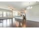 Open living space featuring hardwood floors, recessed lighting, and a kitchen island at 7533 Poplar Meadow Ln, Raleigh, NC 27616