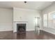 Cozy living room with hardwood floors, fireplace, and lots of natural light at 7533 Poplar Meadow Ln, Raleigh, NC 27616