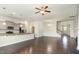 Spacious open-concept living space with hardwood floors and combined kitchen area at 7533 Poplar Meadow Ln, Raleigh, NC 27616