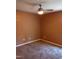 Spacious bedroom with ceiling fan and carpet flooring at 806 Piper St, Durham, NC 27704