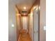 Long hallway with tile flooring and multiple doors at 806 Piper St, Durham, NC 27704