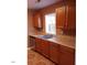 Kitchen with double sink and wood cabinets at 806 Piper St, Durham, NC 27704
