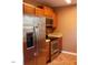 Stainless steel appliances and wood cabinets in kitchen at 806 Piper St, Durham, NC 27704