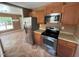 Kitchen with stainless steel appliances and wood cabinets at 806 Piper St, Durham, NC 27704