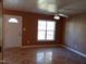 Living room with tile floors and a large window at 806 Piper St, Durham, NC 27704
