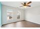Bedroom with a ceiling fan and windows offers views of the surrounding neighborhood at 8204 Yaxley Hall Dr, Raleigh, NC 27616