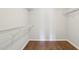 Walk-in closet features wooden floors and wire shelving for optimal storage at 8204 Yaxley Hall Dr, Raleigh, NC 27616