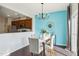 Dining area with modern chandelier and view into kitchen at 8204 Yaxley Hall Dr, Raleigh, NC 27616