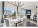 Bright dining room features a table for four and access to the backyard at 8204 Yaxley Hall Dr, Raleigh, NC 27616