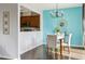 Dining area with modern chandelier and view into kitchen at 8204 Yaxley Hall Dr, Raleigh, NC 27616