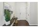 Inviting entryway featuring a console table with decor, leading to a white front door at 8204 Yaxley Hall Dr, Raleigh, NC 27616