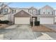 Exterior view of townhomes with attached garages and modern design at 8204 Yaxley Hall Dr, Raleigh, NC 27616
