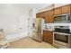 Well-equipped kitchen featuring stainless steel appliances and ample cabinet space at 8204 Yaxley Hall Dr, Raleigh, NC 27616