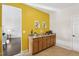 Inviting kitchenette boasts granite countertops, wooden cabinets, and bright lemon-themed decor at 8204 Yaxley Hall Dr, Raleigh, NC 27616